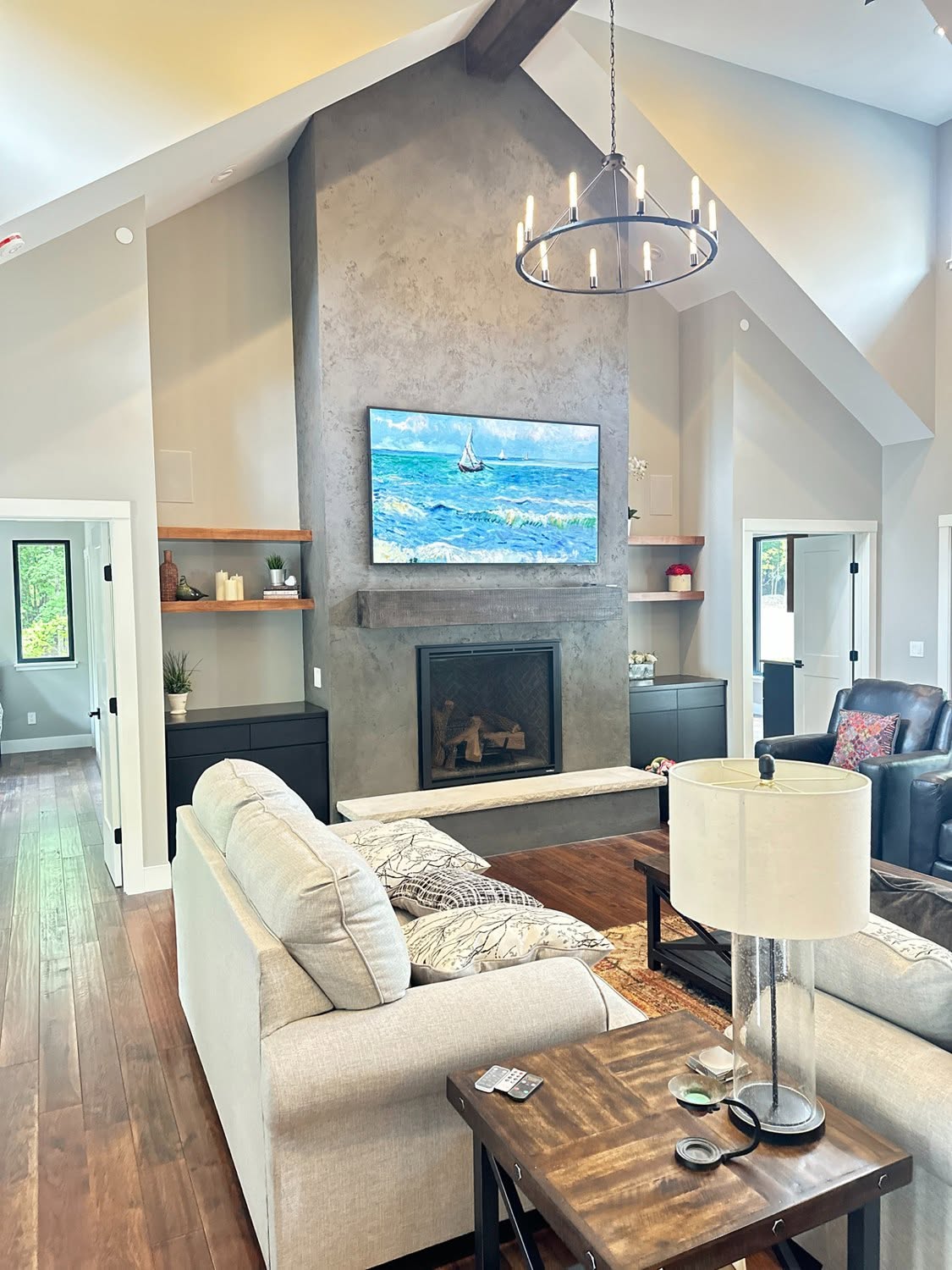 Architectural plaster fireplace and textured feature wall in a finished interior